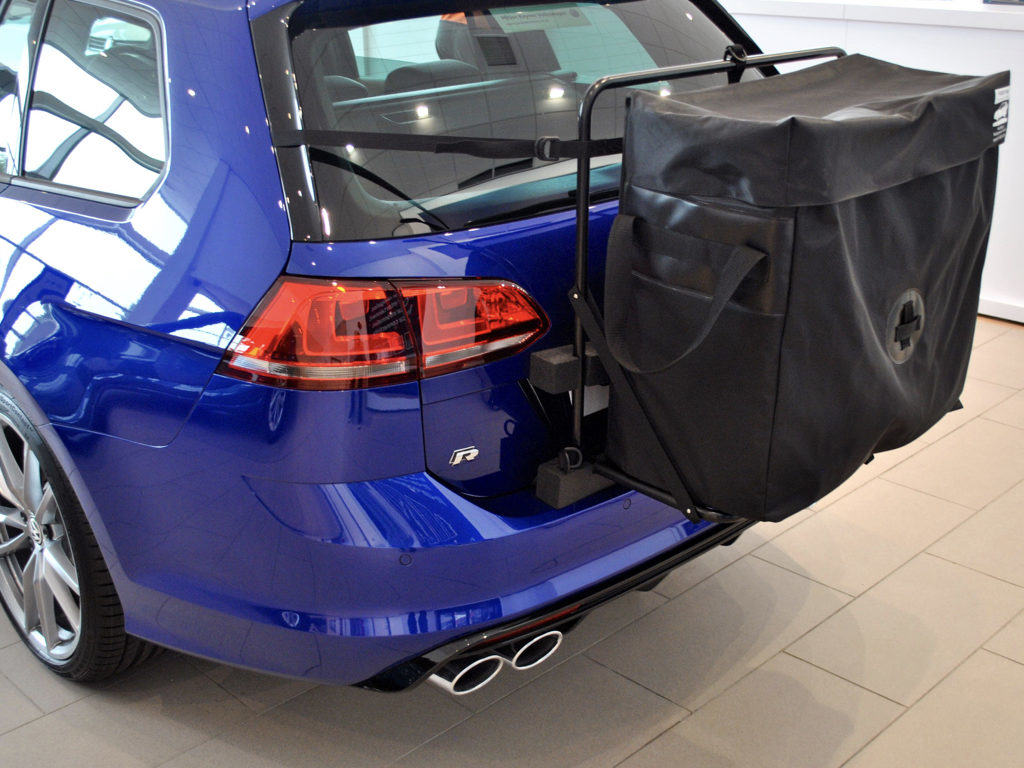 bright blue Volkswagen golf r estate with a hatch-bag roof box alternative fitted to the tailgate
