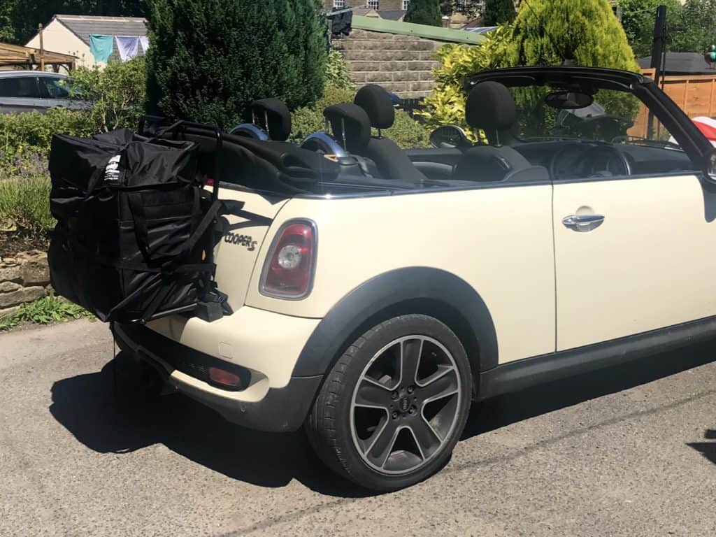 Mini Convertible Luggage Rack hatch bag fitted to a cream mini with the hood down on a sunny day