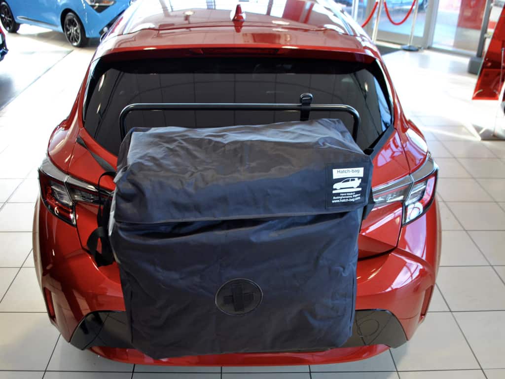 aerial view of a toyota corolla 2019 model with a hatch-bag roof box alternative fitted