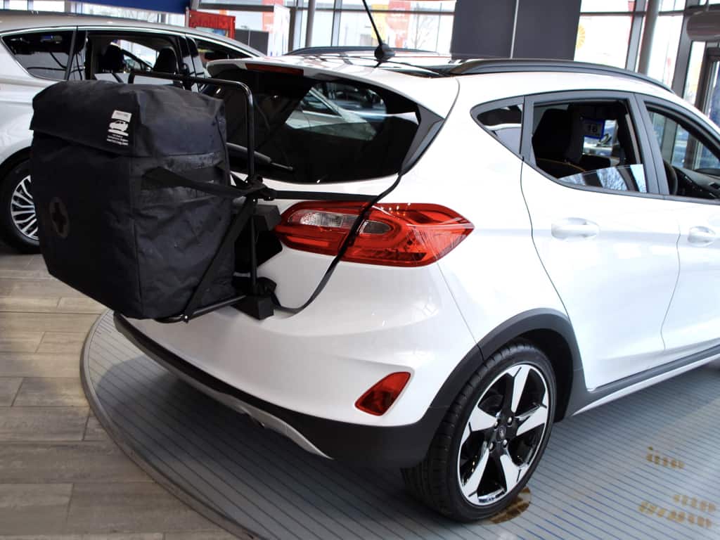 white ford fiesta active with a hatch-bag luggage carrier fitted