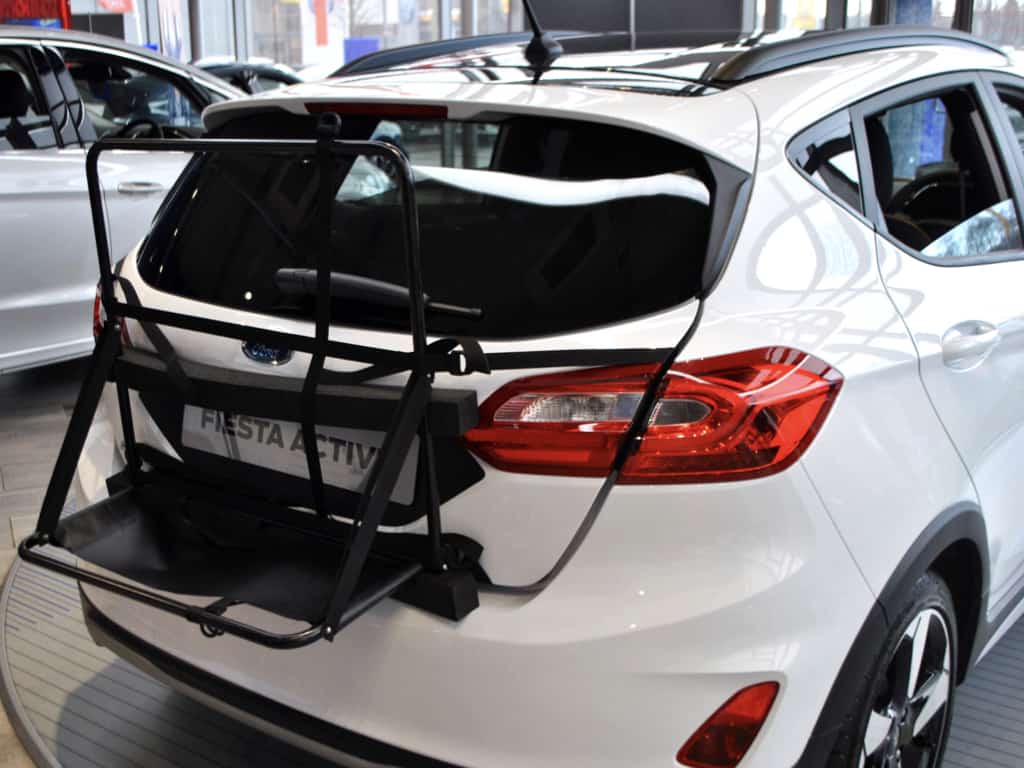 white ford fiesta active with a hatch-bag roof box alternative frame fitted.