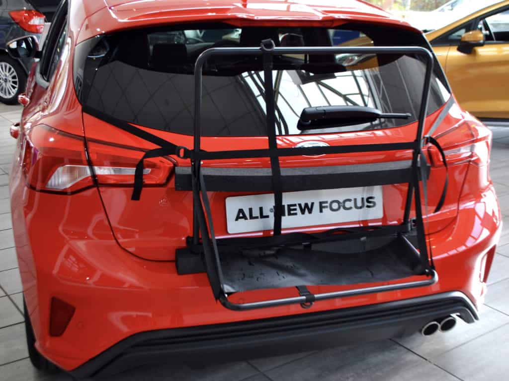 red 2019 ford focus with the hatch-bag roof box frame attached to the rear but without the waterproof bag