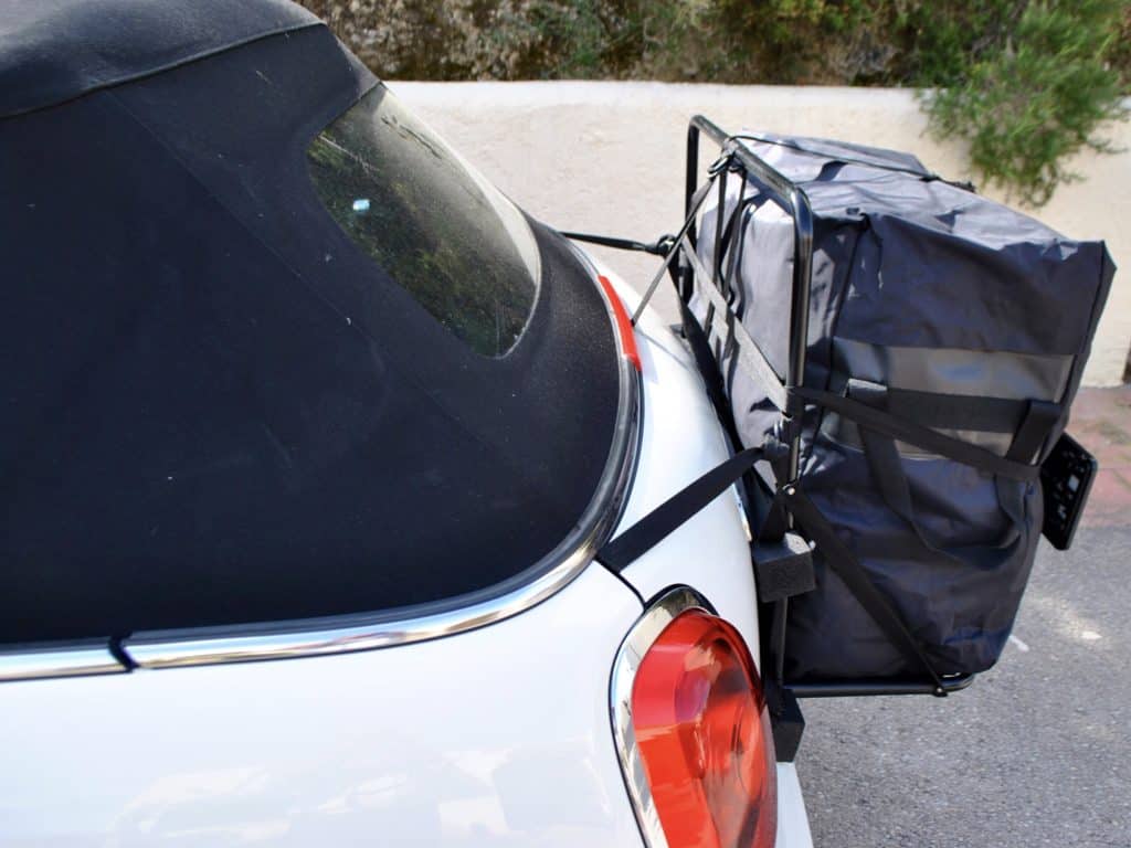 side view of a mini convertible with a hatch bag luggage rack system fitted