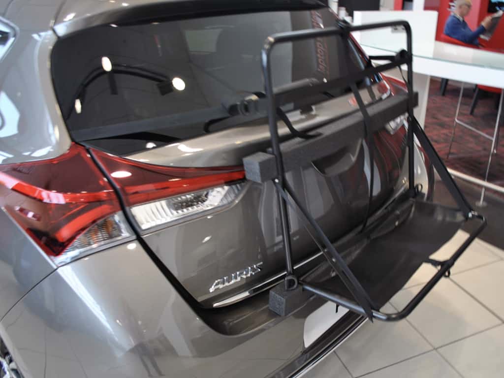 grey toyota auris with a hatch-bag luggage rack frame attached