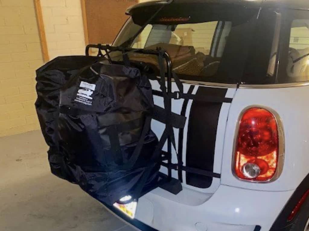 white mini country man in a garage with a hatch-bag roof box fitted