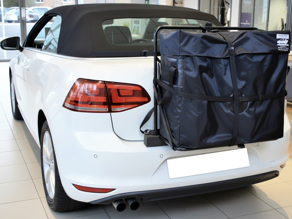 White VW Golf mk7 convertible with a hatchbag luggage rack fitted to the rear photographed from the rear in a VW Showroom